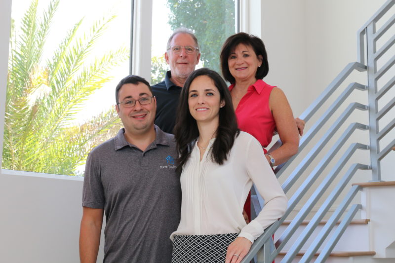 Andy and Erin Katzman with original Rare Builders partners Ross and Robin Katzman inside a completed home.