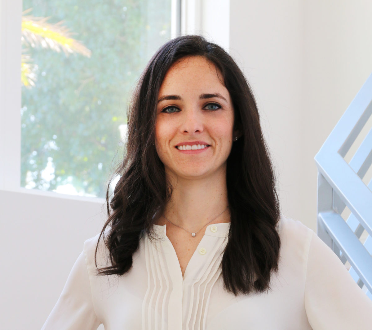 Erin Katzman, co-owner and chief financial officer of Rare Builders, inside a bright modern interior.