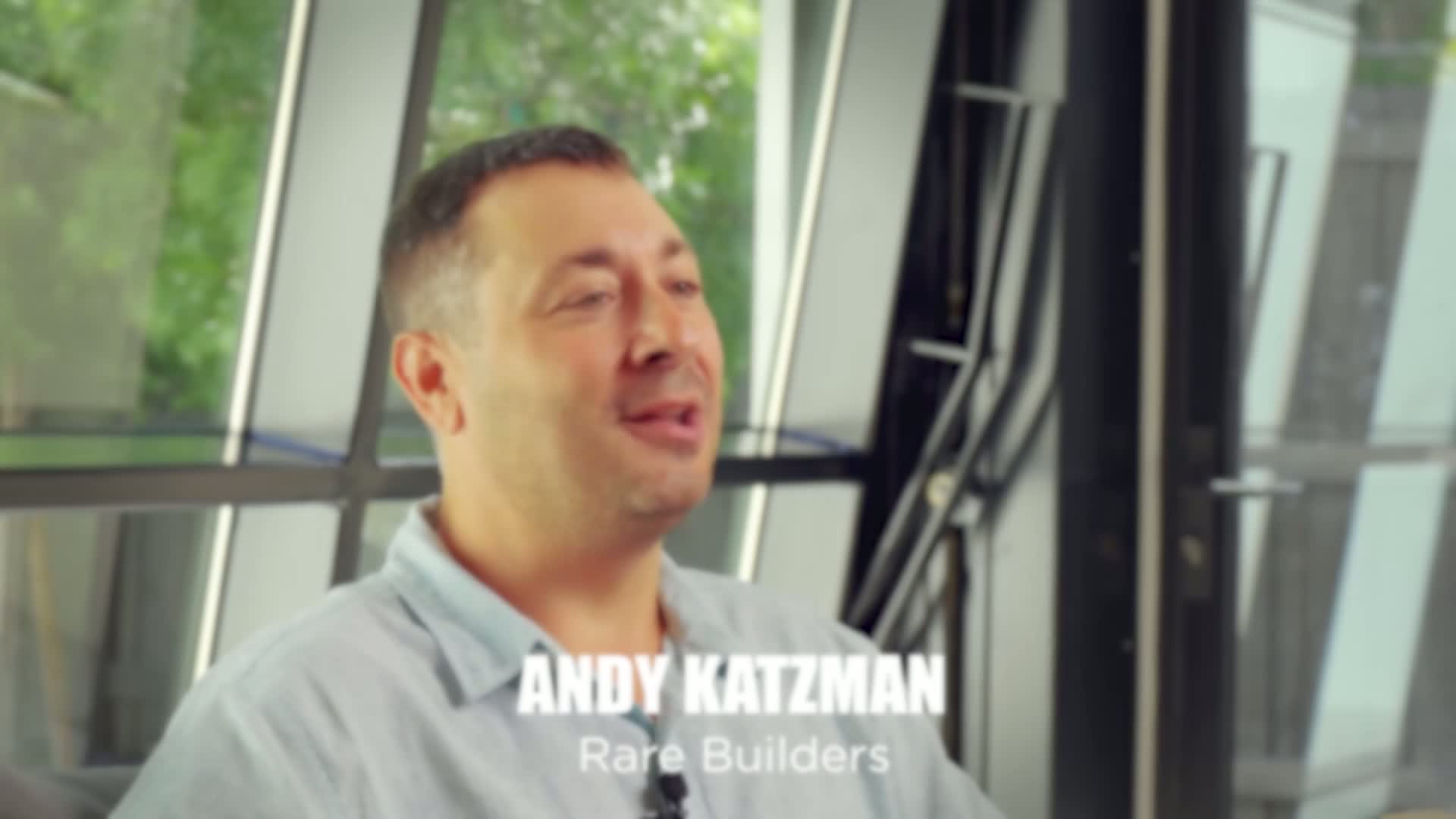 Andy Katzman speaking inside a Rare Builders home in The Rare Builders Story film.