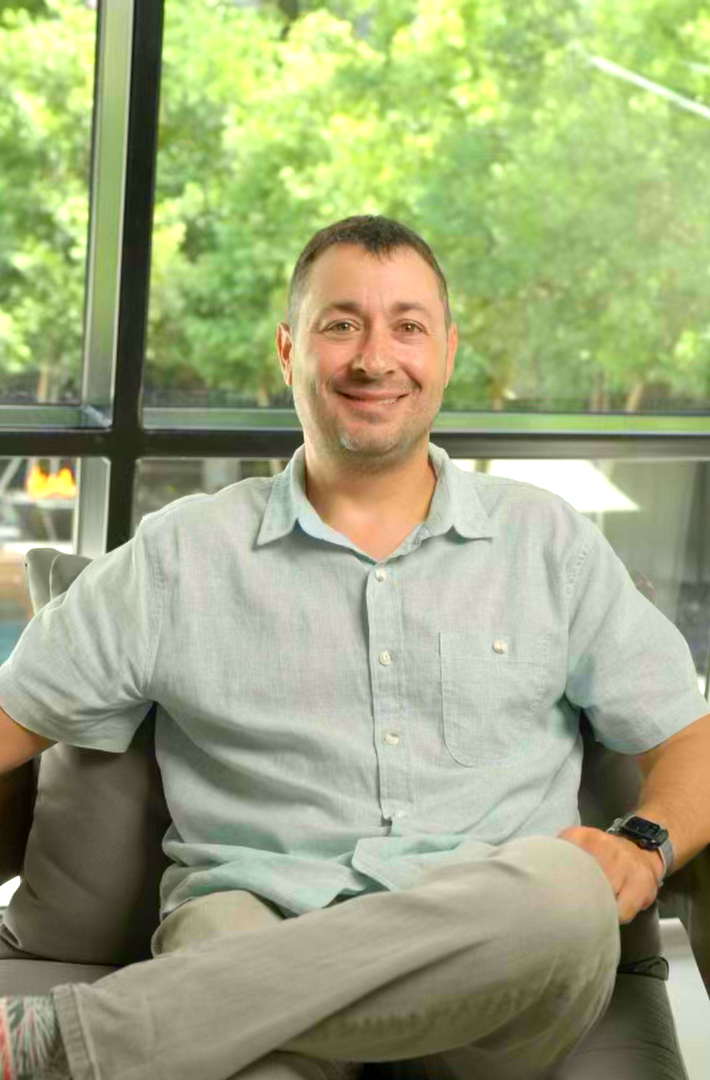 Andy Katzman, builder and founder of Rare Builders, seated inside a completed home.