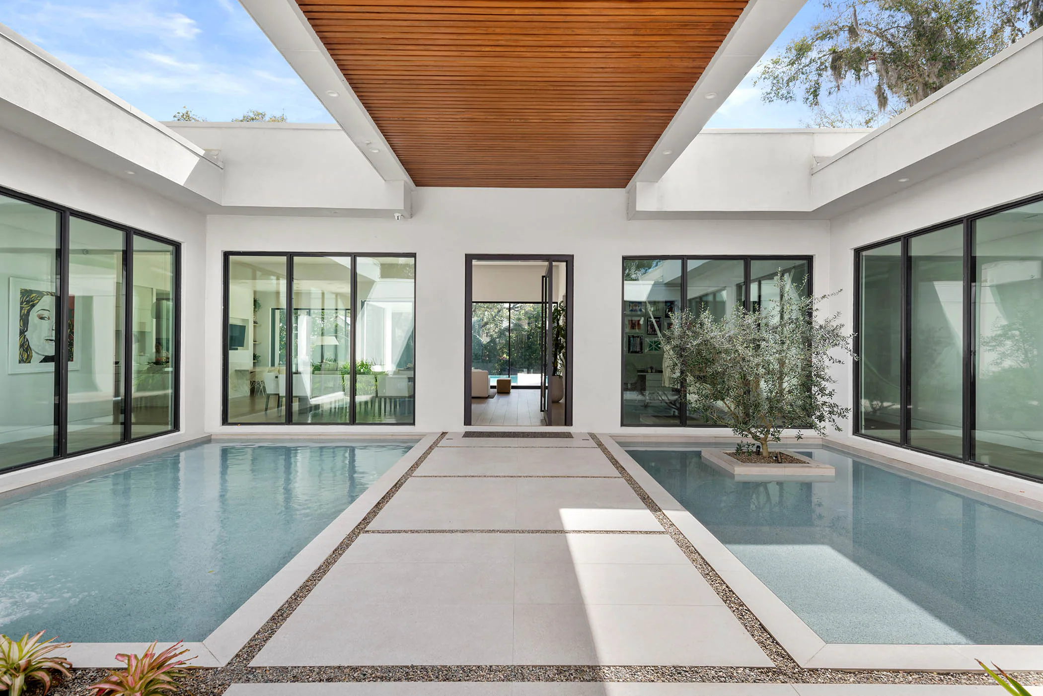 Long view through the courtyard pool toward the rear garden.