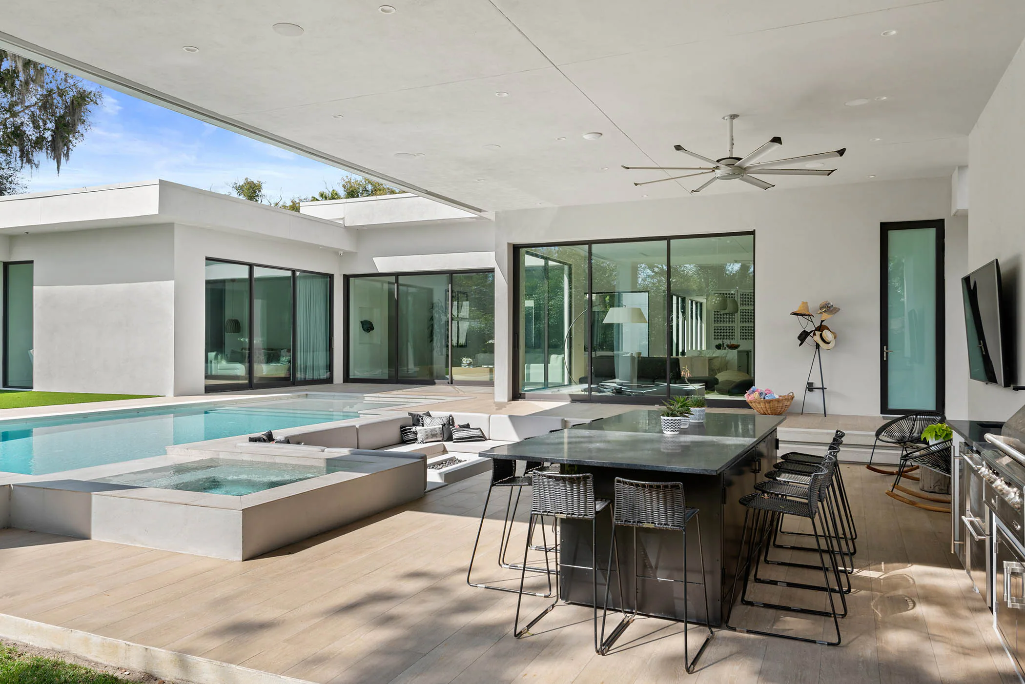 Covered outdoor dining area overlooking the pool.