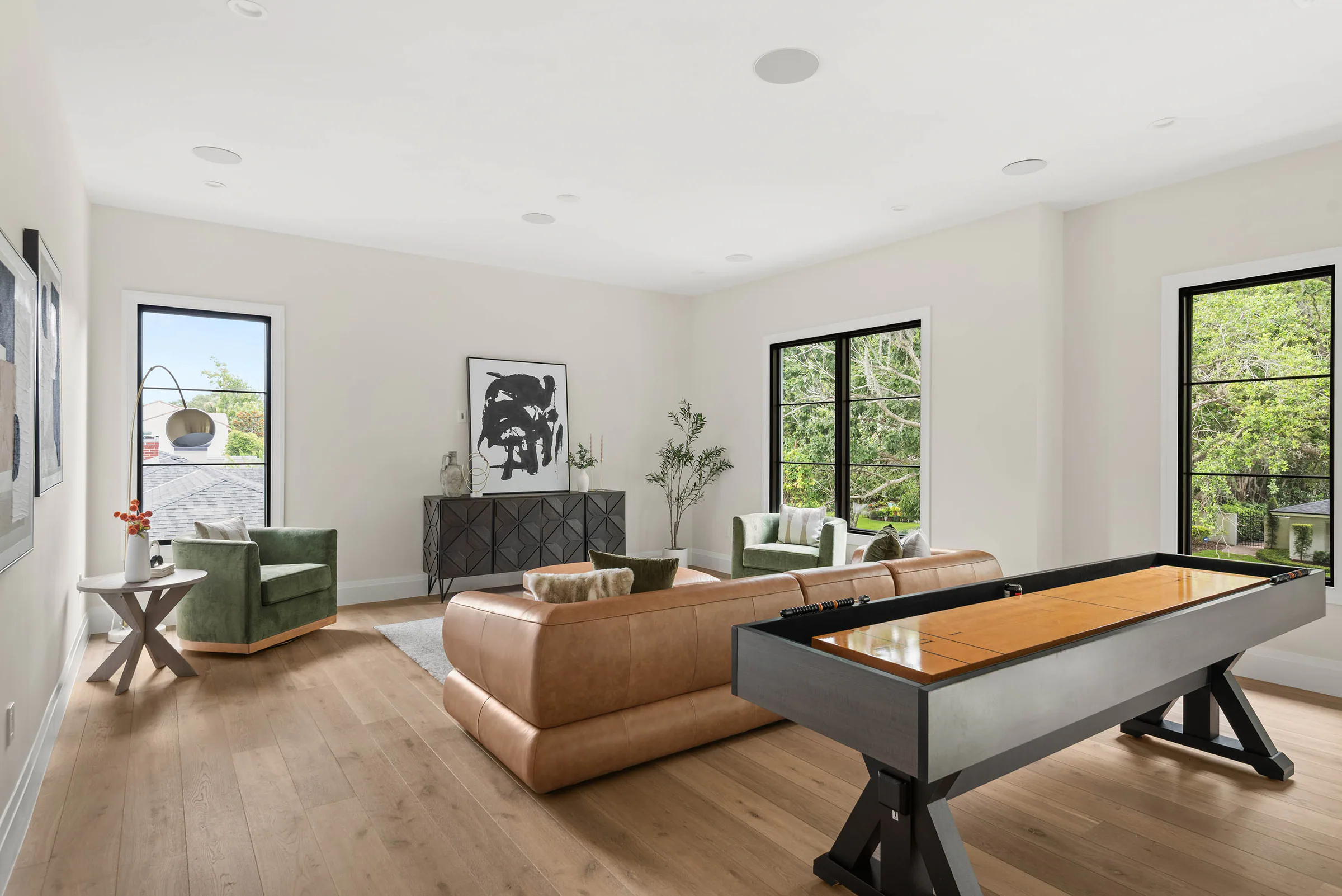 Upstairs game room with seating and a billiards table.
