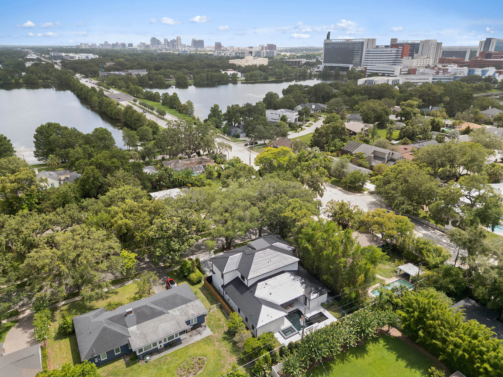 Aerial neighborhood view toward nearby lakes.