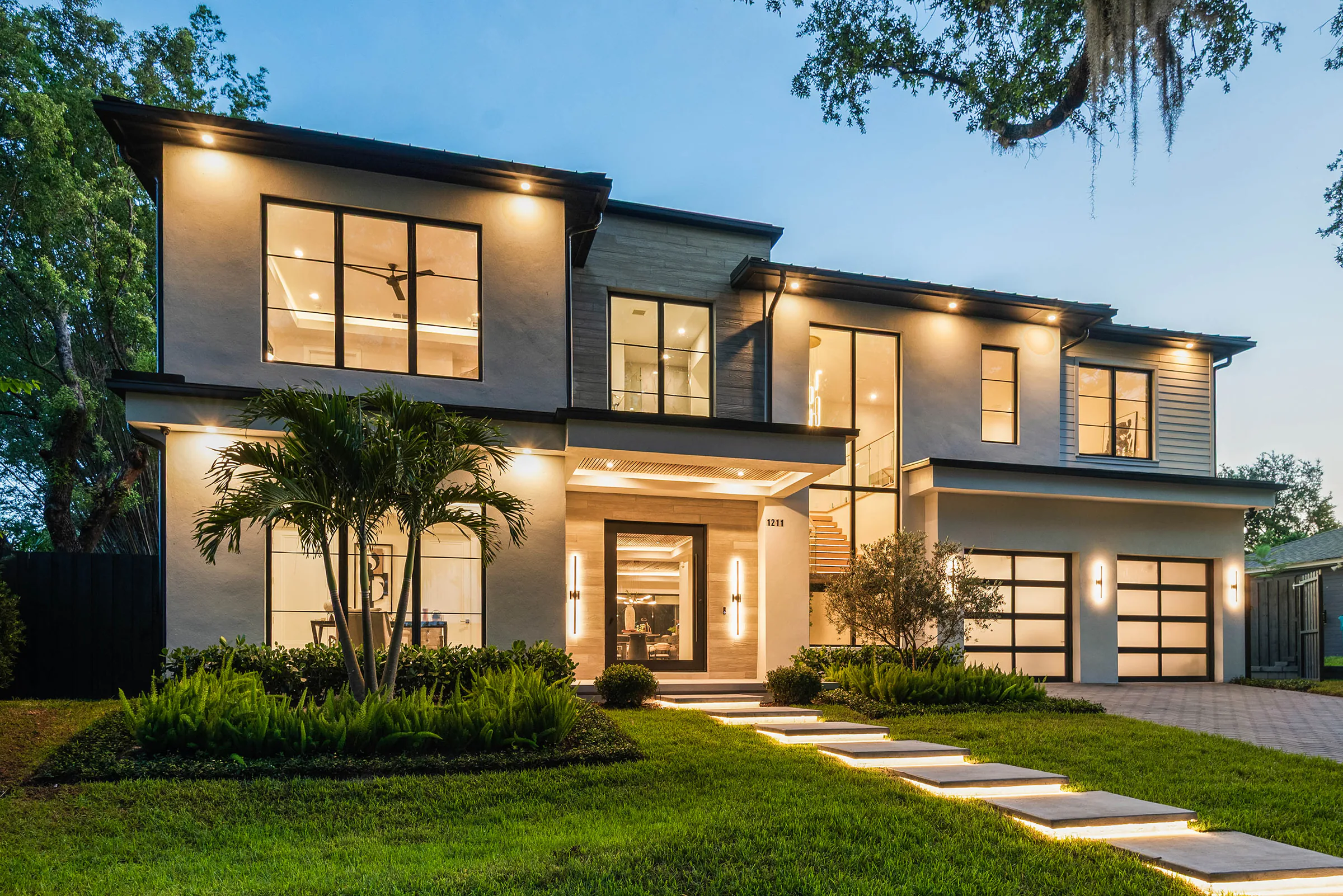 Front elevation illuminated at dusk.