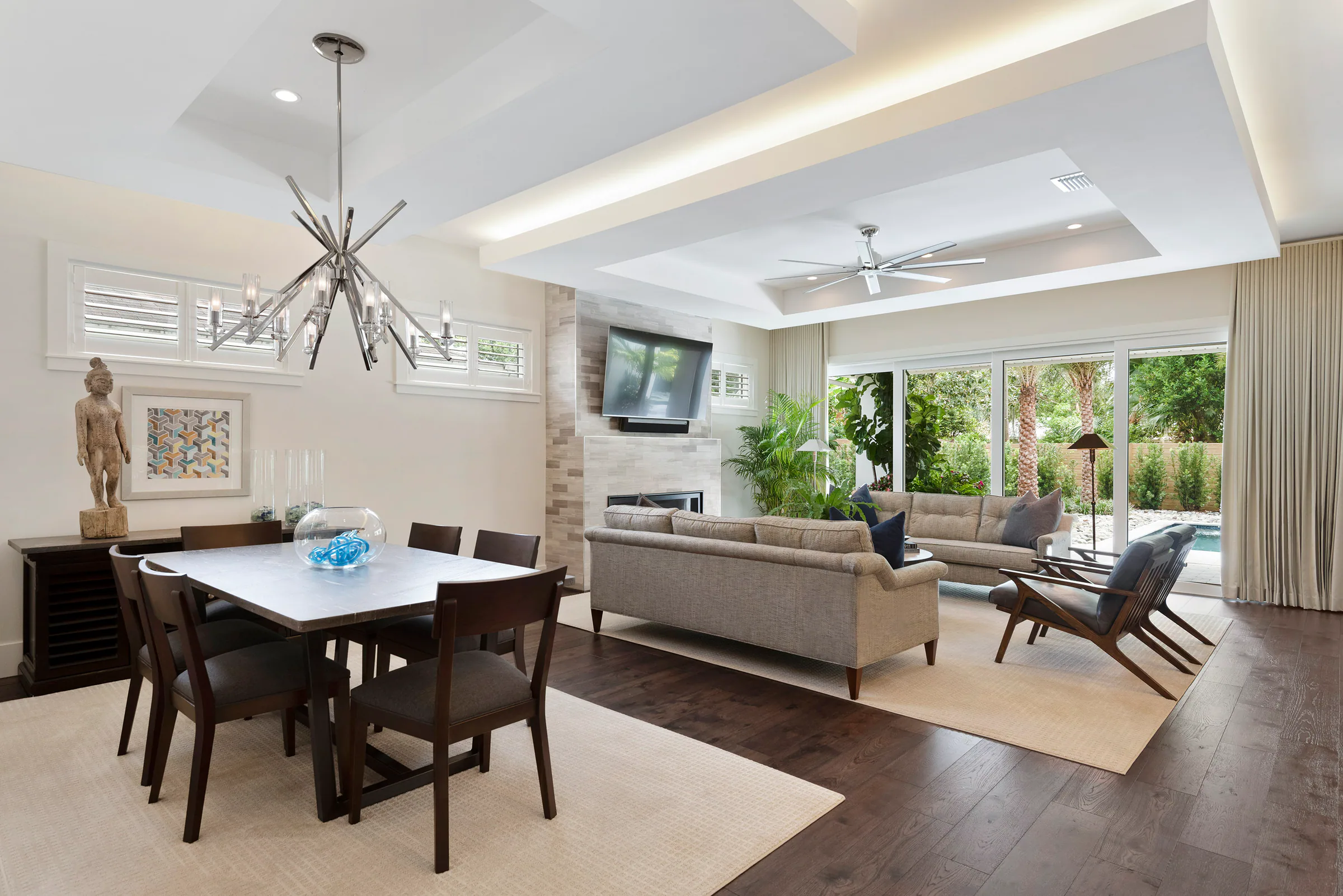 Dining table between the kitchen and bright family room.