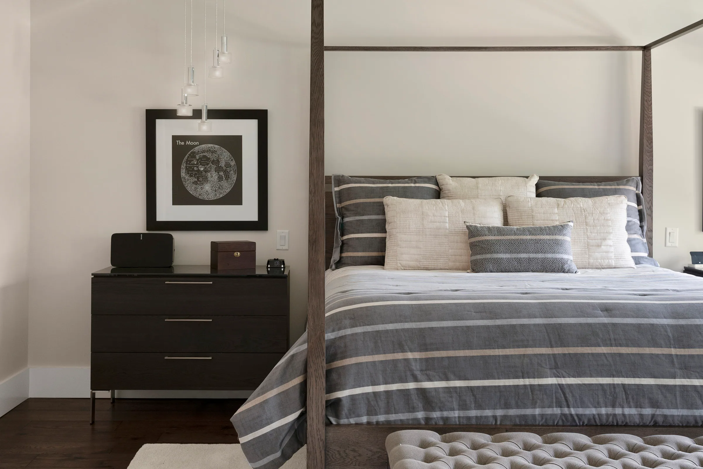 Bedroom with dark wood floor and garden window. Nottingham, a custom home by Rare Builders in Orlando.