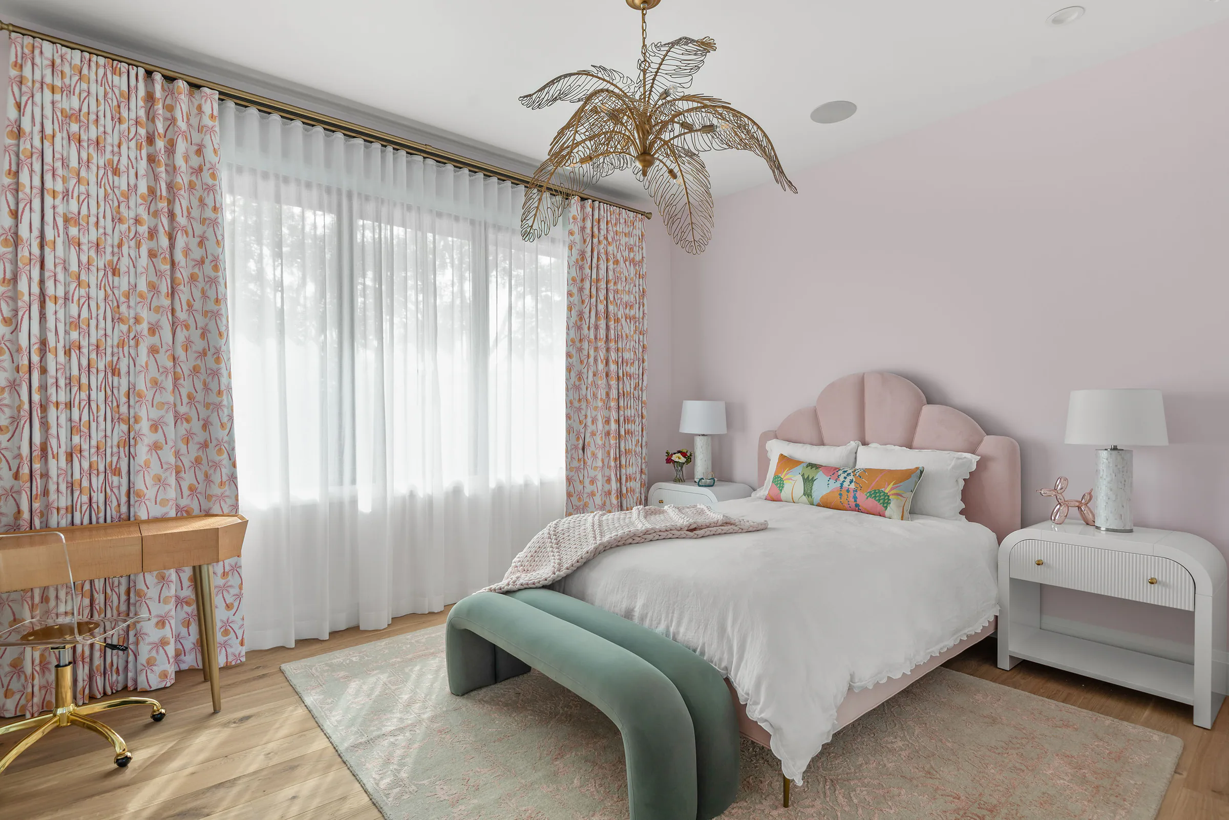 Bedroom with patterned wallpaper and a pale upholstered bed. Rockwood, a custom home by Rare Builders in Orlando.