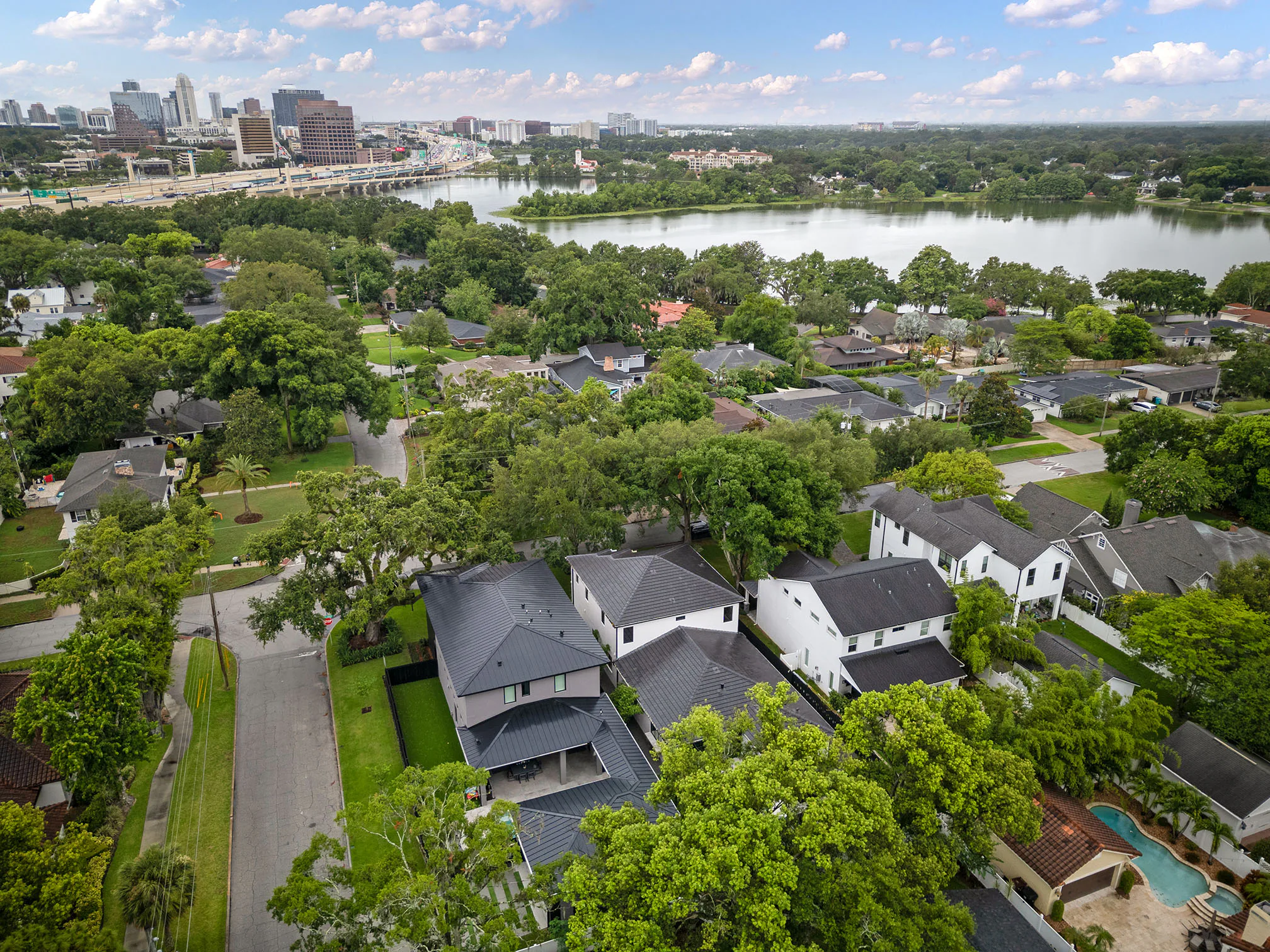 Aerial neighborhood view toward nearby lakes.