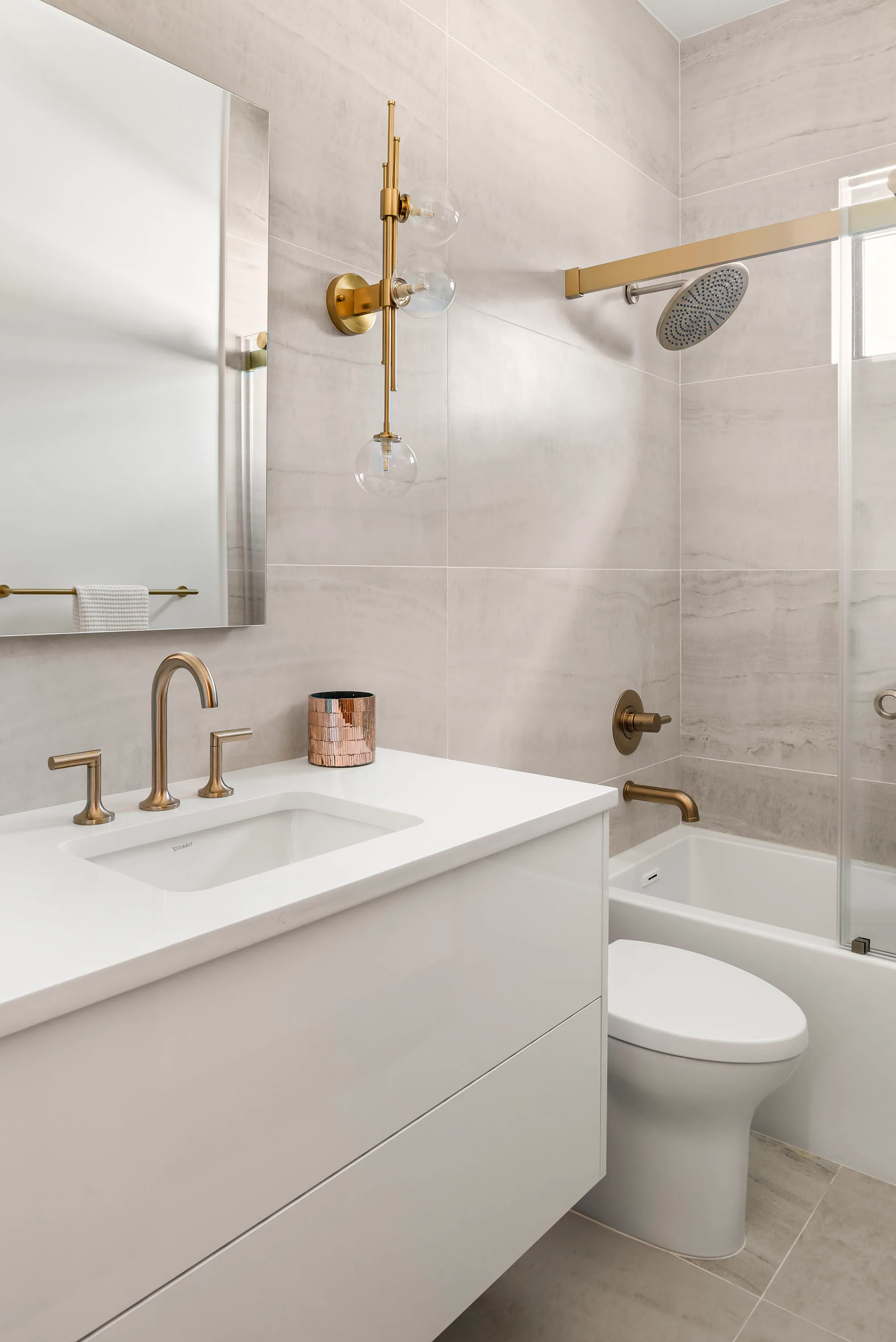 Compact laundry room with white cabinetry.